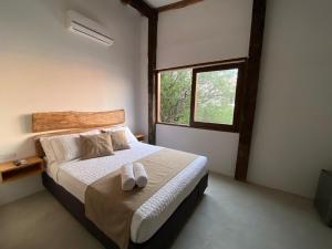 Postel nebo postele na pokoji v ubytování Akela Gaira Hotel