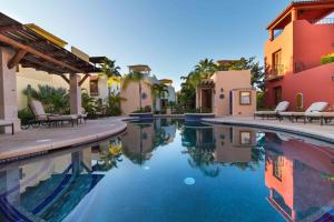 a swimming pool in front of a house at Casa Patricia in Loreto
