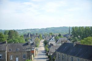 a small town with a street in a city at Demeure de kergoguen in Plougonver