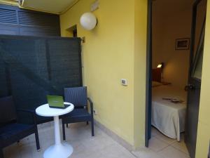 Postel nebo postele na pokoji v ubytování Dependance dell'Hotel Sole e Mare