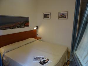 Postel nebo postele na pokoji v ubytování Dependance dell'Hotel Sole e Mare + 4 fotografie