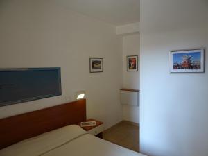 Postel nebo postele na pokoji v ubytování Dependance dell'Hotel Sole e Mare