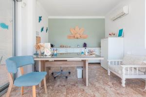 a kitchen with a table and chairs in a room at Bronze Hotel in Oludeniz