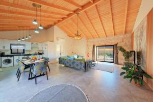 a large living room with a table and a couch at Ader villa 2 in Fethiye