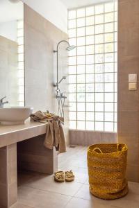 a bathroom with a sink and a shower at Villa Seven in Lachania