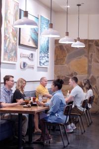 een groep mensen aan een tafel in een restaurant bij Treasure Bay Casino & Hotel-Adults Age 21 and Above in Biloxi