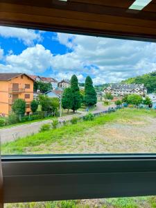 a view from a window of a city street at apartamento em gramado in Gramado