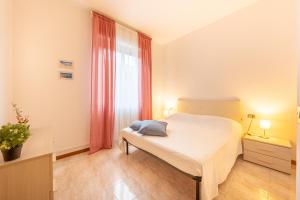 Ένα ή περισσότερα κρεβάτια σε δωμάτιο στο Verdi Bilo Roseto Vacanza