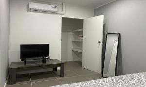 A television and/or entertainment centre at Apartment Curacao