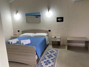 Postel nebo postele na pokoji v ubytování Is Arenas Biancas Agriturismo