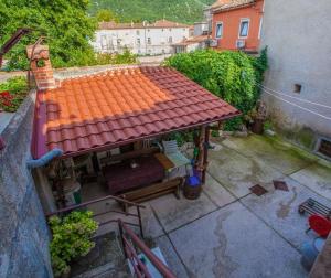 an overhead view of a house with an orange roof at Room Kaštelan in Cres