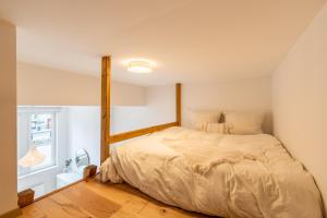 Кровать или кровати в номере Casita Loft