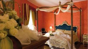 Postel nebo postele na pokoji v ubytování Albergo Ristorante Uliveto