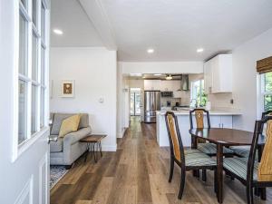 a kitchen and living room with a table and chairs at Fantastic 2 bedroom Cottage, 5min to beach in Santa Cruz