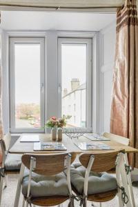 a table and chairs in a room with a window at Tiny home at Dundee in Dundee