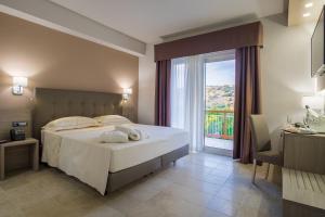 Postel nebo postele na pokoji v ubytování Netum Hotel + 37 fotografií