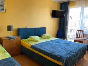 Łóżko lub łóżka w pokoju w obiekcie Międzyzdrojanka