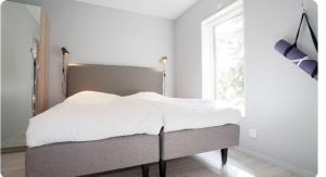 เตียงในห้องที่ Chalet with sauna, JÄRVSÖ