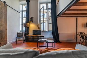 Zona d'estar a Loft calme à la Maison Carrée - Une Nuit à Nîmes