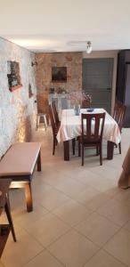 a dining room with a table and chairs at Sea View in Alikí