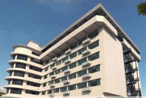 a large white building with balconies on it at Avana Laem Chabang Boutique Hotel in Ban Laem Chabang