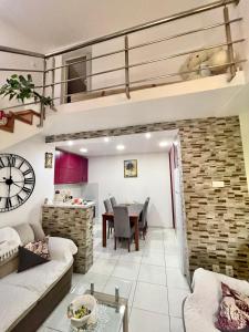 a living room with a couch and a table at Apartman Guberinic,Tivat ,trosoban stan in Tivat