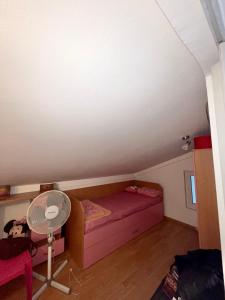 a small room with a bed and a table at Apartman Guberinic,Tivat ,trosoban stan in Tivat