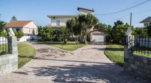 a driveway leading to a house with a gate at Senia Holidays in Preveza