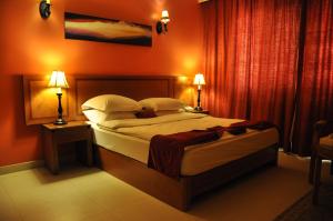 Ένα ή περισσότερα κρεβάτια σε δωμάτιο στο La Rosa Hotel By Brother International