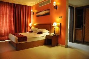 Ένα ή περισσότερα κρεβάτια σε δωμάτιο στο La Rosa Hotel By Brother International
