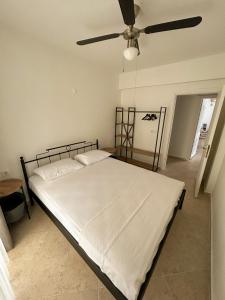 Een bed of bedden in een kamer bij Somos Flats