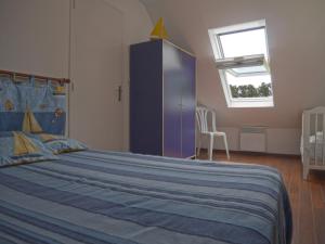 a bedroom with a large bed and a purple cabinet at Maison de qualité avec jardin paysager à Sauzon - FR-1-418-38 in Sauzon