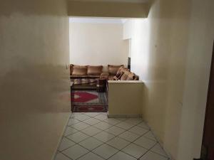a hallway with a couch in a room at Appartement spacieux à Agadir in Agadir