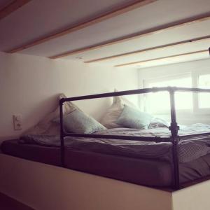 a bunk bed in a room with a window at La Tejita Beachhouse in La Tejita