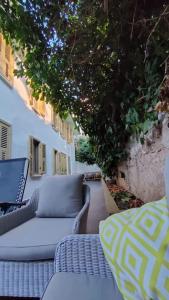 a patio with wicker chairs and a couch at Beautiful Villa with Garden Princess Islands in Istanbul