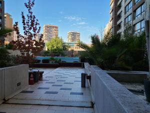 a walkway in the middle of a city with buildings at Departamento Santa Lucía in Santiago