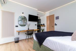 Postel nebo postele na pokoji v ubytování Palm Luxury Suite