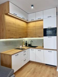 Kuchyňa alebo kuchynka v ubytovaní Apartamenty KAPRYS - Centrum