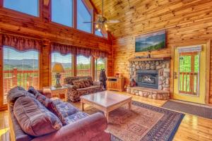 a living room with a couch and a fireplace at Awesome Views #701 in Gatlinburg