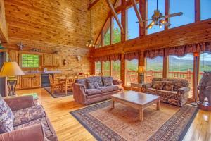 a living room with couches and a table at Awesome Views #701 in Gatlinburg