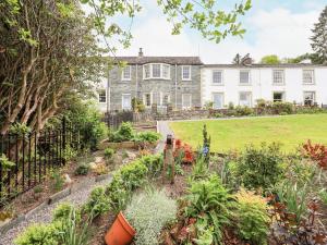 a garden in front of a large house at Grisedale View in Keswick