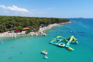 an aerial view of a beach with a water slide at Apartment Neli in Polača