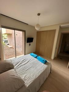 Een bed of bedden in een kamer bij Appartement résidentiel Prestigia