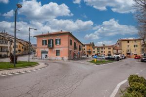an empty street in a town with buildings at Smart Room Abbadia S S - Camere LuxuryModernStyle con Cucina Condivisa in Abbadia San Salvatore