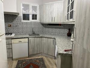 a kitchen with a sink and a counter top at Kale House Nar in Nevşehir