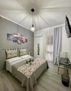 Un pat sau paturi într-o cameră la Rosaria's Home
