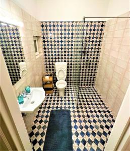 a bathroom with a toilet and a sink at NEW LISTING IN THE HEART OF BUDAPEST Apartment Kamilla in Budapest