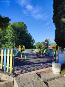 a playground with a slide in a park at Sirena condo 50 m from the central beach in Byala
