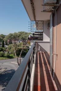 a balcony of a building with a view of a street at EUR Mostacciano - 6 ospiti WIFi AC in Rome