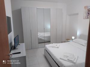 Postel nebo postele na pokoji v ubytování La casetta di Alessandro
